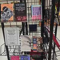Black wire book display containing books relevant to Hispanic and Latinx Heritage Month