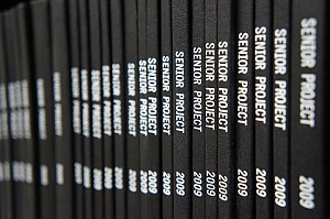 Bound Senior Projects on a shelf in the Library.