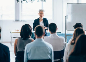 Office leader speaking in front of a group