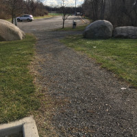    View of existing unpaved pathway near athletic fields. 