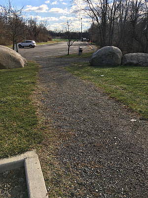    View of existing unpaved pathway near athletic fields. 