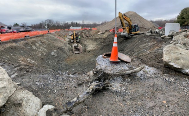 View of the damaged storm drain beneath West 1 being excavated.