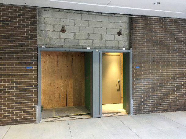 New door frames being installed at doors to Theater C.