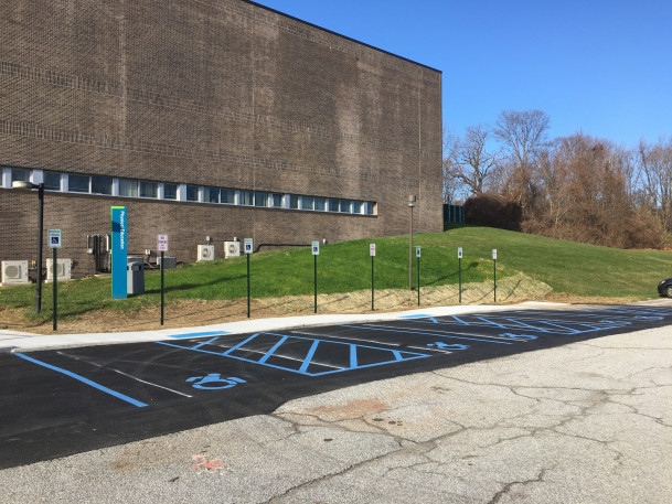 View of new accessible parking spaces at rear of Gym.