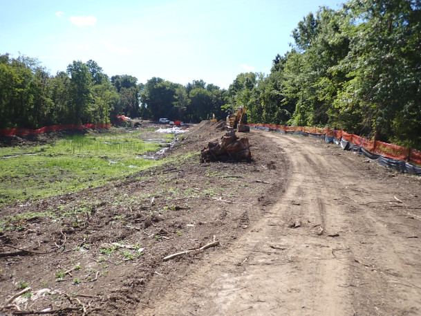 View of contractor clearing area for new enlarged detention pond.