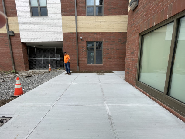 View of newly poured sidewalk at Fort Awesome.