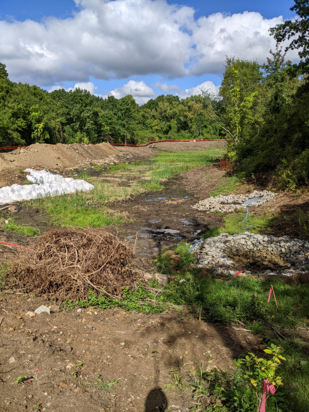 View of newly enlarged detention pond under construction.