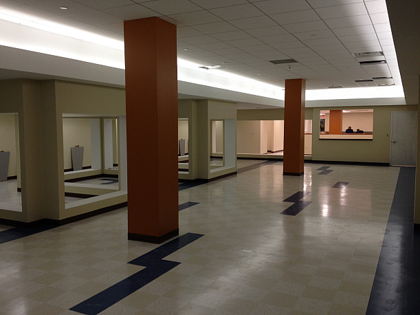 View of the new Mailroom lobby with finishes and new lighting going in.
