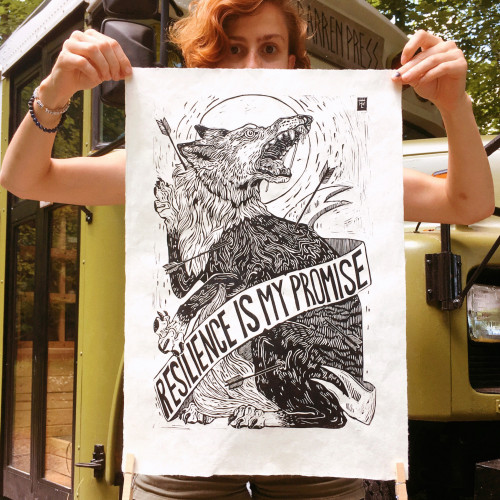 Holly Williams '15 holds up one of her prints.